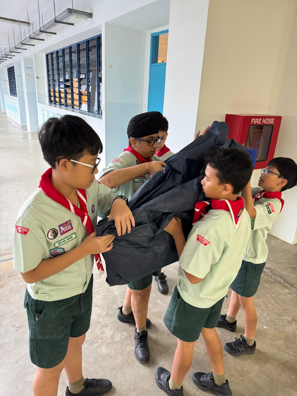 Team work in Folding a Pitched tent